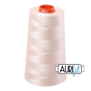 May include: A spool of off-white thread with a bright orange label that says "Aurifil" and a blue label that says "Aurifil" with a trademark symbol.