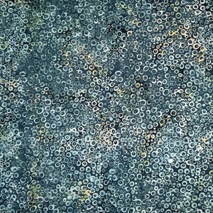May include: A dark teal fabric featuring a dense, all-over pattern of irregular, hand-drawn white and light gray circles. The design creates a textured, bubble-like appearance across the surface, with varying sizes of rings layered over a deep, moody background.