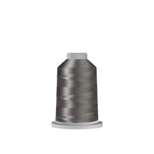May include: A spool of dark gray sewing thread featuring a cylindrical shape with a slightly tapered top and a wider base. The thread is wound tightly around the central core, displaying a smooth, consistent texture and a subtle sheen throughout.