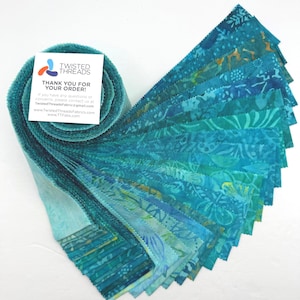May include: A jelly roll of batik fabric strips in various shades of teal, turquoise, and blue, featuring diverse patterns. A square white card is attached to the top, displaying the text Twisted Threads, Thank You For Your Order, and contact info.