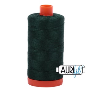 May include: A spool of dark green thread with an orange top and base. The thread is tightly wound around a cylindrical core. The brand name "AURIfil" is printed on the side of the spool. This thread is suitable for sewing and quilting projects.