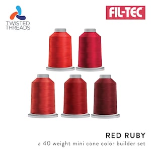 May include: A set of six mini cones of red embroidery thread in various shades of red, labeled "Red Ruby" and "a 40 weight mini cone color builder set". The thread is made by Fil-Tec and Twisted Threads.