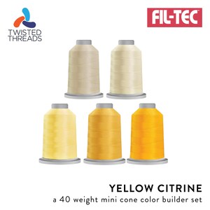 May include: A set of five mini cones of thread in varying shades of yellow and cream, labeled Fil-Tec Twisted Threads and Yellow Citrine a 40 weight mini cone color builder set. The spools are arranged in two rows with two on top and three on bottom.