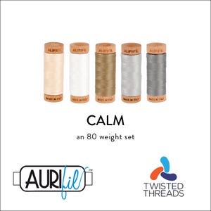May include: A set of five spools of Aurifil thread in a variety of neutral colors, including beige, white, gray, and light brown. The spools are labeled "Aurifil" and "Made in Italy". The set is labeled "Calm" and "an 80 weight set". The Aurifil logo and the Twisted Threads logo are also visible.