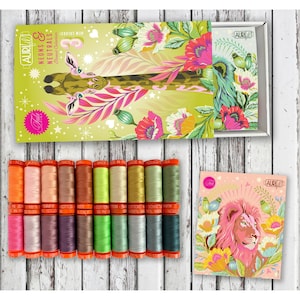 May include: A collection of Aurifil thread spools in various colors, including orange, pink, and green, with a decorative box featuring a giraffe and floral design. The box reads "Neons & Neutrals Thread Collection."