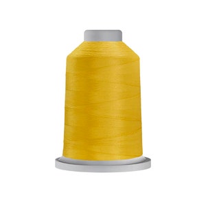 May include: A spool of bright yellow thread for sewing or embroidery.