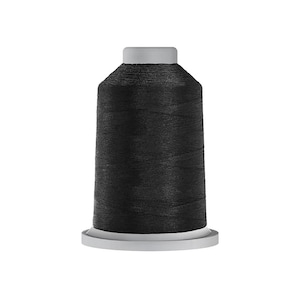 May include: A spool of black thread for sewing or embroidery.