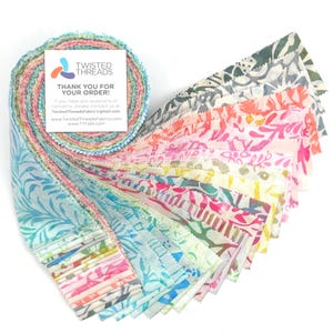 May include: A colorful fabric roll with a variety of patterned designs in shades of pink, blue, green, and yellow. The fabric is fanned out, showcasing the different patterns. A small card with the text "THANK YOU FOR YOUR ORDER!" is visible.