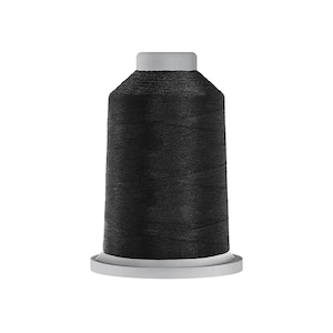 May include: A large spool of black sewing thread featuring a cylindrical shape with a flat base and a flat top. The thread is tightly wound around the central core, creating a smooth, uniform texture across the entire surface of the spool.