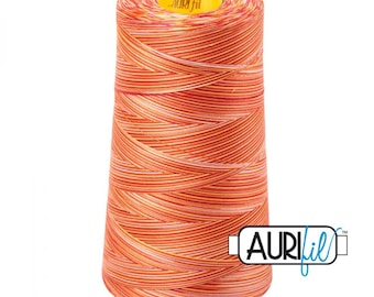 May include: A large spool of Aurifil thread in shades of orange, red, and yellow. The thread is tightly wound, with a yellow cap on top. The Aurifil logo is visible on the side of the spool. Ideal for sewing and quilting projects.