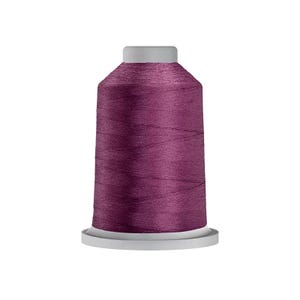 May include: A spool of deep plum purple sewing thread wound tightly around a cylindrical core. The thread has a smooth, slightly lustrous finish, and the spool features a flat, light gray base and a matching light gray top cap.