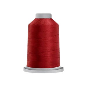 May include: A spool of deep red sewing thread wound tightly around a cylindrical core. The thread features a smooth, consistent texture and a vibrant, saturated color. The spool has a light gray plastic base and a matching light gray top cap.