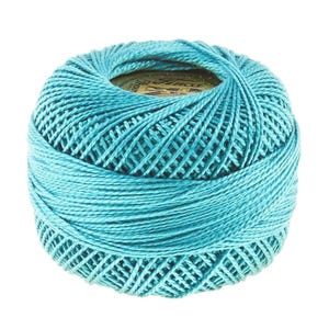 May include: A spherical ball of turquoise crochet thread wound in a tight, crisscross pattern. A circular paper label with the text Finca is visible at the top center of the ball, partially tucked into the wound thread structure.