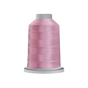 May include: A spool of pink embroidery thread.