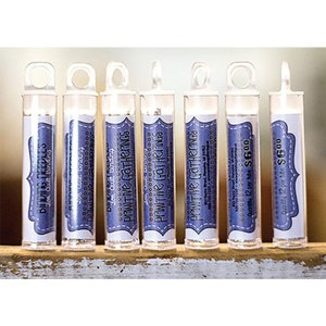 May include: Six small clear tubes with labels that say "Primitive Gatherings" and "Quantity 12 per box $600". The tubes contain small spools of thread.