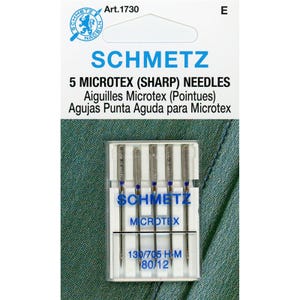 May include: A package of 5 Schmetz Microtex (Sharp) sewing needles in a clear plastic case. The needles are silver and the case is labeled with the brand name and size: 130/705 HM 80/12.
