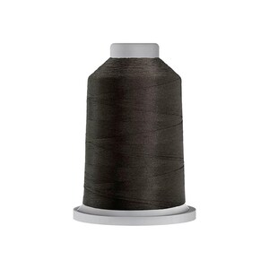 May include: A spool of dark charcoal gray sewing thread. The thread is wound tightly around a cylindrical plastic core with a flat white base and a matching white top cap, creating a uniform and smooth appearance for the dark textile fiber.