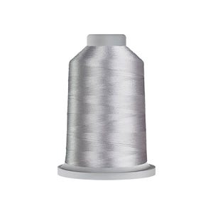 May include: A spool of light silver-gray embroidery thread featuring a smooth, lustrous finish. The thread is tightly wound around a cylindrical plastic core with a flat base and a slightly tapered top, showcasing a consistent metallic sheen.