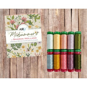 May include: A set of ten small spools of 100% cotton thread by Aurifil, labeled Midsummer Stitching by Sharon Holland. The collection includes five 40wt and five 12wt spools in various colors, presented with a floral-patterned cardboard display card.