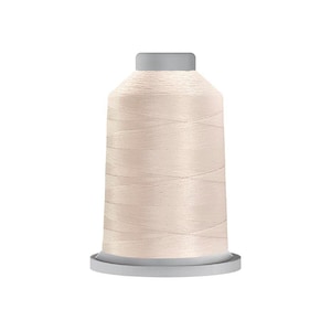 May include: A spool of pale pink thread for sewing or embroidery.