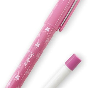 May include: Pink sewing glue stick with a floral design and the word "Sewline" printed on the side. The glue stick comes with a separate pink cap.