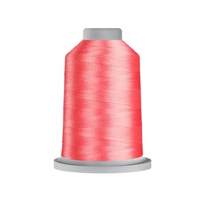 May include: A spool of vibrant coral-colored sewing thread wound tightly around a cylindrical core. The thread features a smooth, slightly reflective texture, and the spool is finished with a flat, light gray plastic base and a matching top cap.