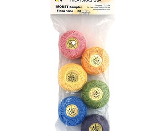 May include: A package of six colorful skeins of embroidery floss, labeled "Presencia Hilaturas USA" and "MONET Sampler Finca Perle 08".