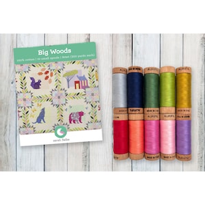 May include: A quilt pattern called "Big Woods" with a green background and a white border. The pattern features a variety of woodland animals and plants. The pattern is surrounded by 10 spools of thread in various colors. The spools are labeled "Aurifil" and are made in Italy.