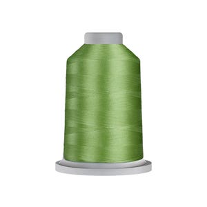 May include: A spool of sewing thread in a vibrant sage green color. The thread is tightly wound around a cylindrical plastic core with a flat top and a wider circular base, creating a smooth, uniform surface texture throughout the entire spool.