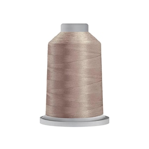 May include: A spool of thread in a muted, dusty mauve color. The thread is wound tightly around a cylindrical plastic core with a flat top and a wider base. The surface of the thread has a subtle sheen and a smooth, uniform texture throughout.