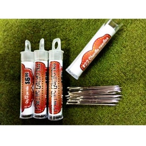 May include: Three clear plastic tubes containing 12 #22  Charmille needles each. The tubes are labeled "Primitive Gathering" and "Only 12 per tube $6.00".