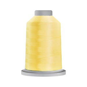 May include: A spool of light yellow sewing thread featuring a cylindrical shape with a flat top and a wider circular base. The thread is wound tightly around the central core, creating a smooth, uniform surface texture in a bright, pale yellow color.
