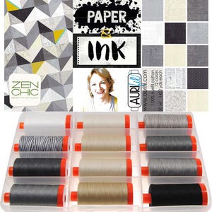 May include: A collection of twelve spools of thread in a clear plastic organizer box. The thread colors include white, shades of gray, black, and beige. The packaging features the text Paper & Ink, Zen Chic, and Aurifil, showcasing 100% cotton thread.
