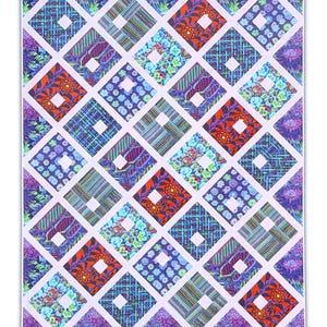 May include: A colorful quilt with a repeating diamond pattern. Each diamond features a unique design, including floral, striped, and paisley patterns in shades of blue, purple, orange, and green. The diamonds are separated by white lines, creating a grid-like appearance.