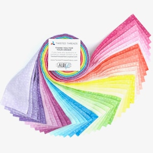 May include: A jelly roll of fabric strips featuring a rainbow gradient of colors including purple, blue, green, yellow, orange, and pink, all with a subtle white polka dot pattern. A white square card with the text Twisted Threads and Aurifil is attached.