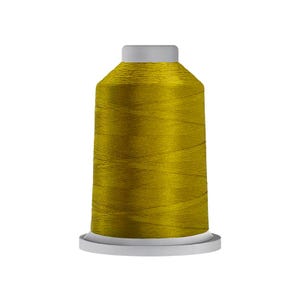 May include: A spool of metallic gold embroidery thread featuring a smooth, lustrous finish wrapped around a cylindrical core with a flat white base and a matching white top cap, displaying a consistent, tightly wound texture throughout the spool.