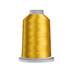 May include: A spool of golden yellow embroidery thread featuring a smooth, lustrous finish. The thread is wound tightly around a cylindrical core with a flat, light gray base and a matching light gray top cap, creating a uniform shape.