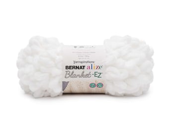 Puede incluir: Una madeja de hilo blanco Bernat Alize Blanket-EZ con bucles preformados para tejer con los dedos. La etiqueta central de papel muestra la marca, el nombre del producto y un peso de 180 gramos, junto con iconos de instrucciones de tejido.