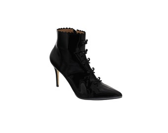 black patent leather ankle boots adorned with bows