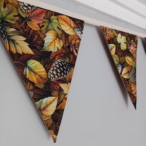 Autumn leaves and pine cones bunting. Fabric fall decoration.