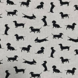 May include: A seamless pattern featuring black dachshund silhouettes on a light gray background. The dachshunds are in various poses, including running, jumping, and standing.