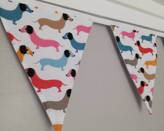 Dog Fabric Bunting - colourful sausage dogs on a white background fabric. Approx 2.5 metre length
