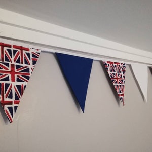 May include: A bunting with alternating flags in red, white, and blue, with a Union Jack pattern on the first flag.