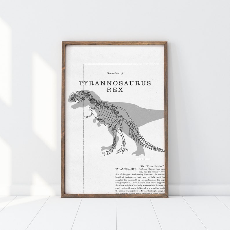 May include: A framed print featuring a detailed illustration of a Tyrannosaurus Rex skeleton with a shadow. The text "Restoration of TYRANNOSAURUS REX" is at the top. The print has a vintage aesthetic with a brown wooden frame.