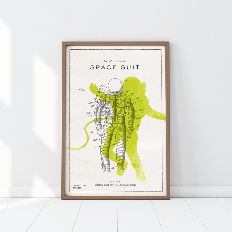 May include: A vintage illustration of a flexible astronaut space suit patent drawing. The drawing is in black and white with a green watercolor wash behind the astronaut. The text reads "Flexible Astronaut Space Suit" and "FIG. 1".