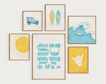 May include: A set of six framed prints with a beach theme. The prints feature a blue jeep, two surfboards, a wave, the word "SURF" in blue letters, a yellow sun, and a hand making the shaka sign.