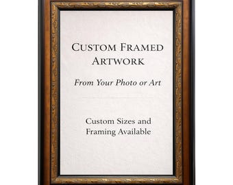 May include: A framed artwork with a black and gold ornate frame. The artwork has a white background with the text "CUSTOM FRAMED ARTWORK" and "From Your Photo or Art". The text "Custom Sizes and Framing Available" is also visible.