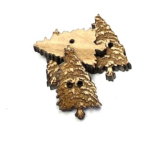 May include: Three wooden Christmas tree buttons with a brown wood grain finish. The buttons have two holes each.