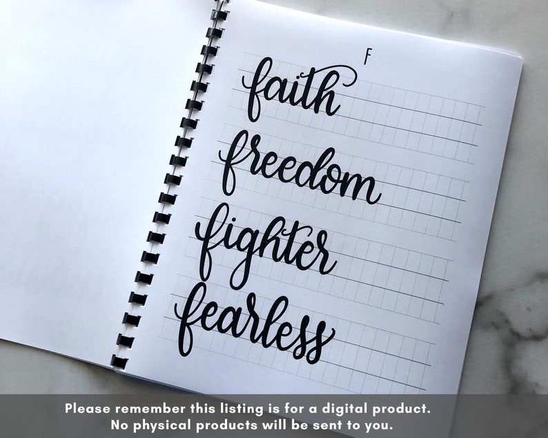 May include: A notebook page with a grid pattern and four words written in cursive: faith, freedom, fighter, and fearless.