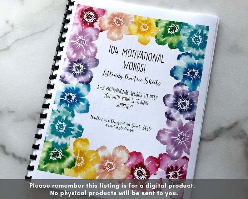 May include: A spiral bound book with a watercolor floral design on the cover. The title is "104 Motivational Words! Lettering Practice Sheets". The text says "A-Z Motivational Words to Help You With Your Lettering Journey!"